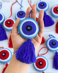 Blue Evil Eye Bag Charm Tassel on hand